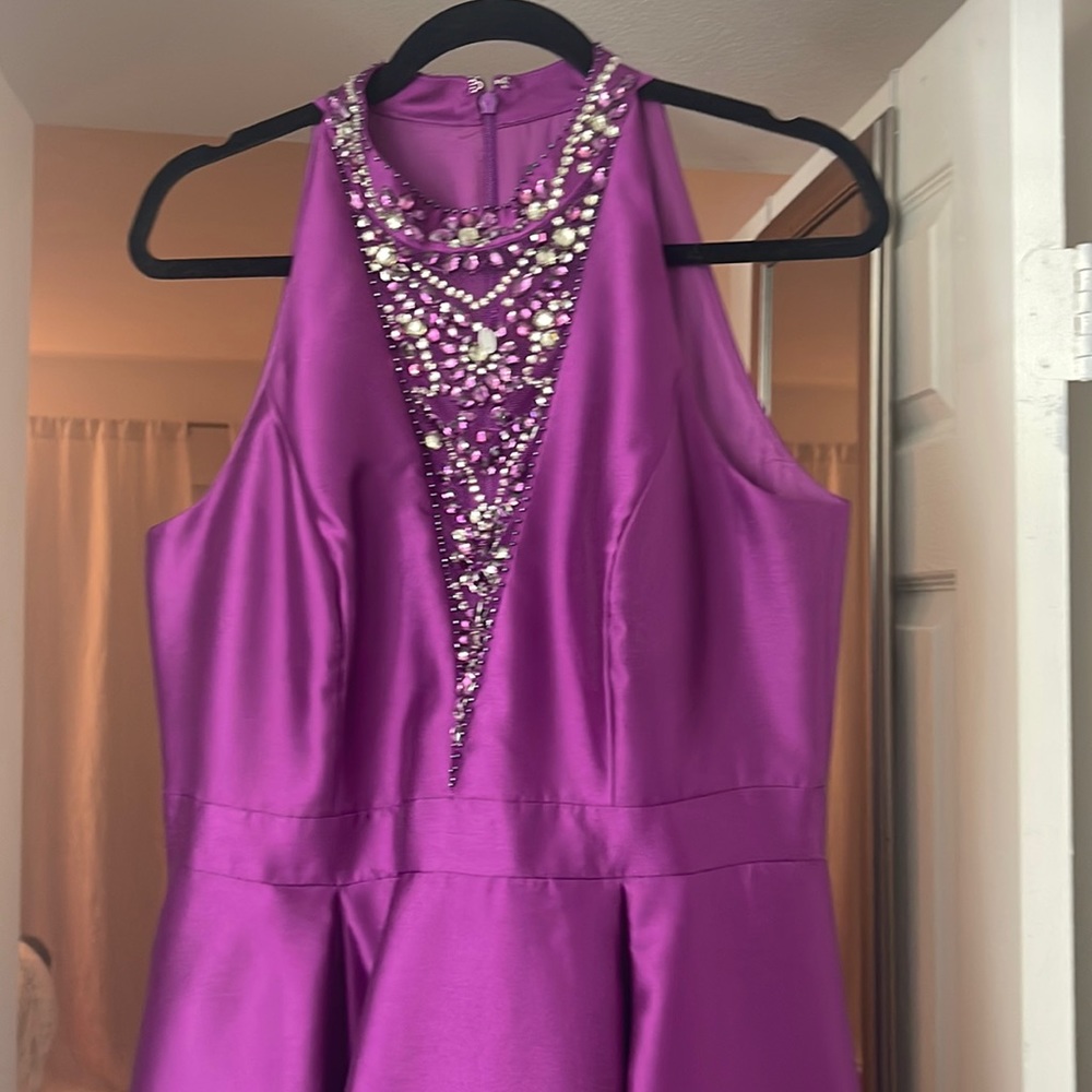 Fuchsia high low Adrianna Papell embellished gown.
